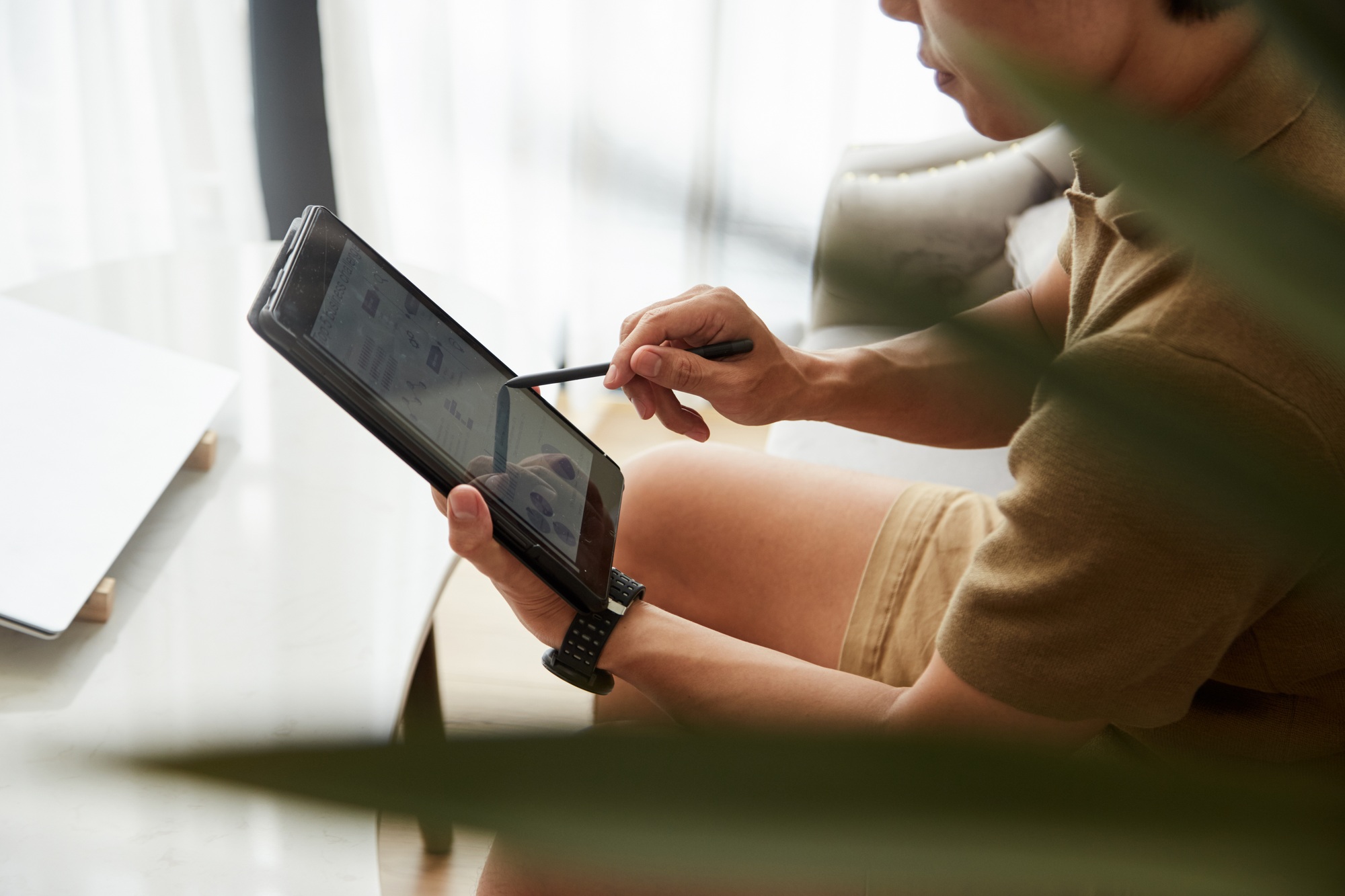 Entrepreneur Checking Report on Tablet