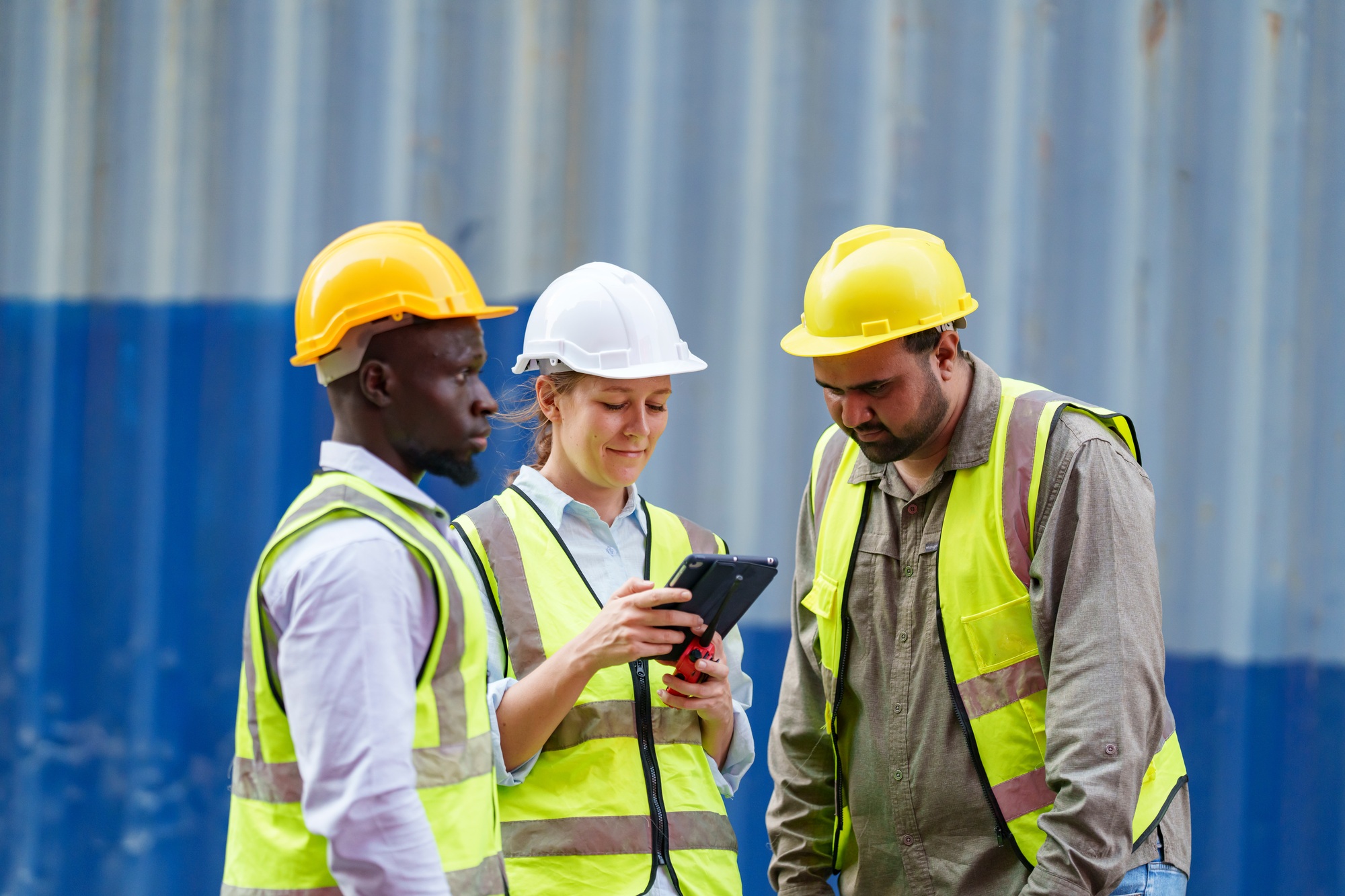 Construction workers collaborating on a project at a construction site during daylight